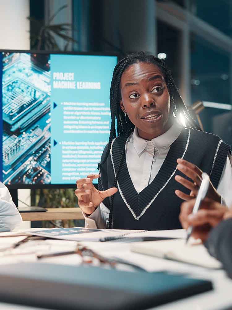 woman working with ai explaing to colleague