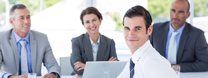Young man giving thumbs up after a panel job interview